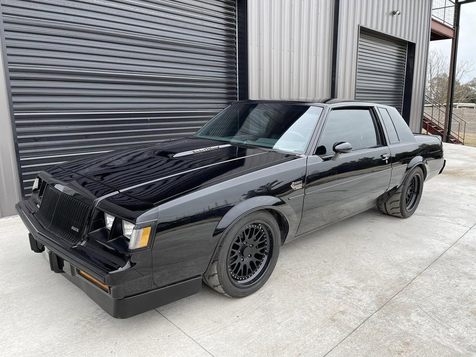 1987 Buick Grand National in front of the shop